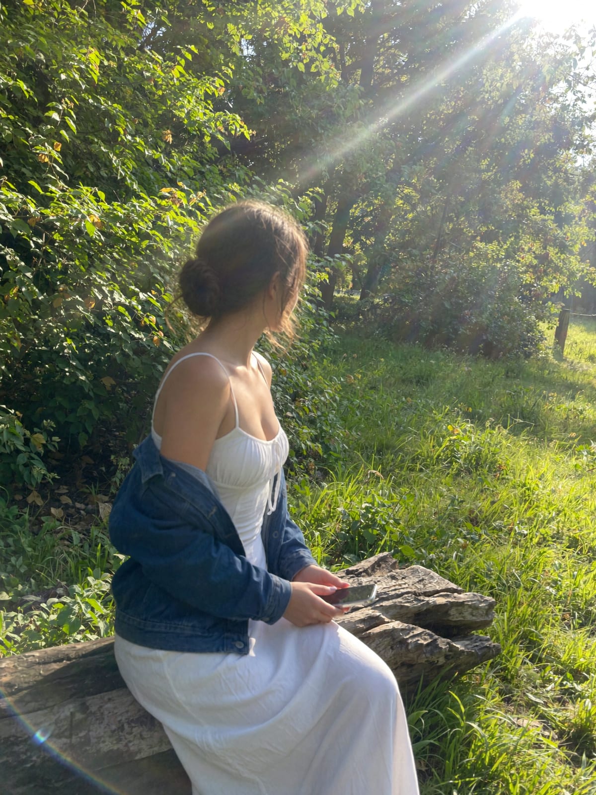 Realistic AI model in natural sunlight — photorealistic lighting, lens flare and film grain